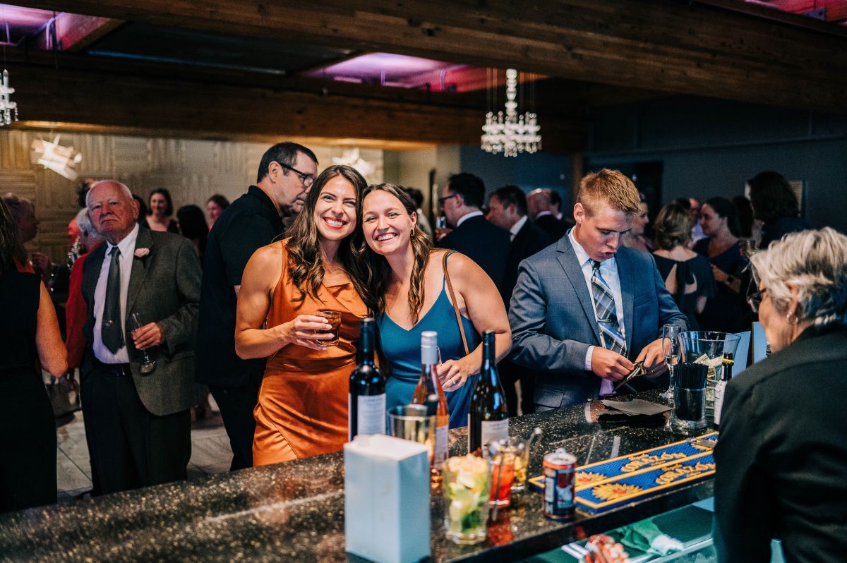 Guests posing at the bar at A'BULAE