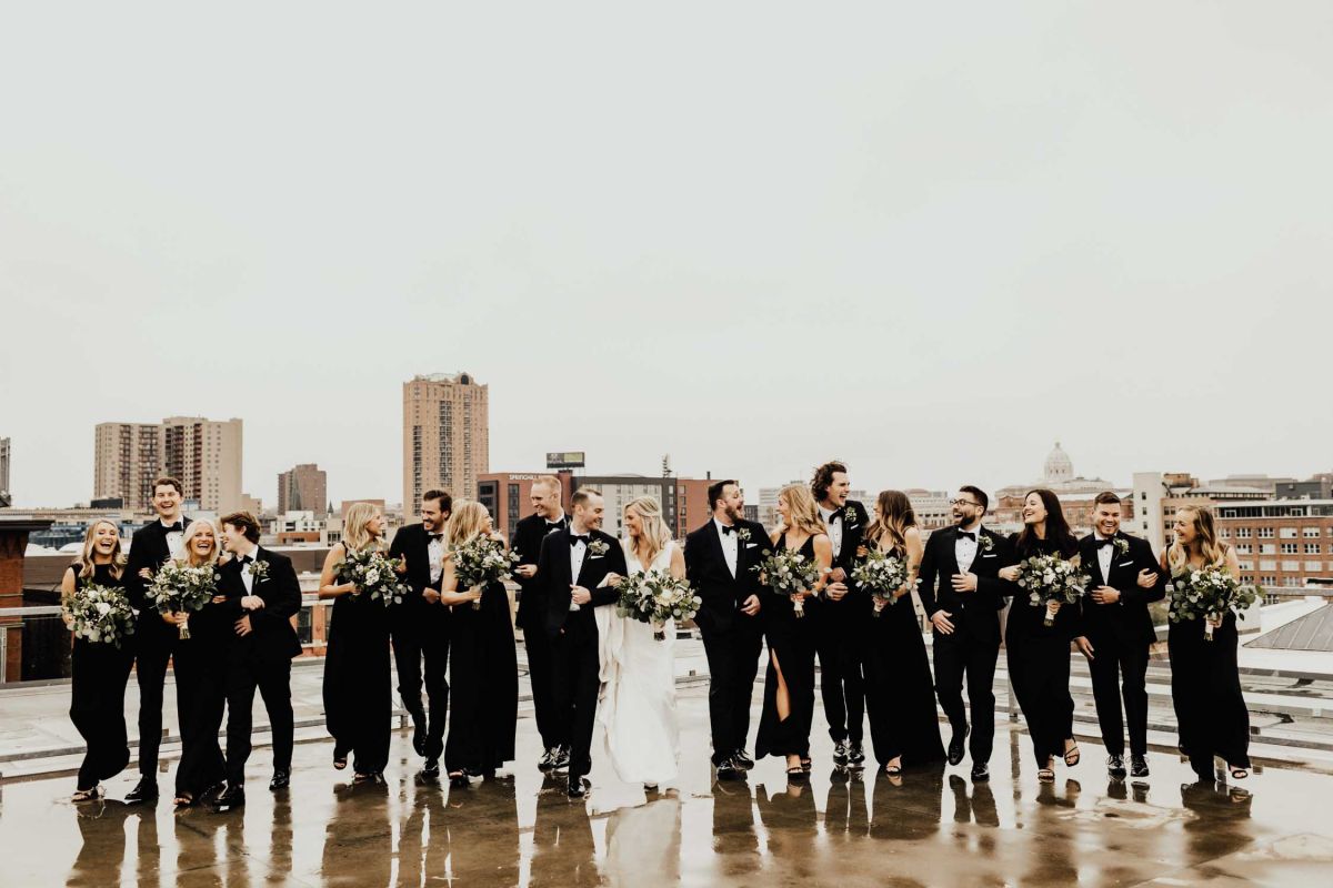 wedding party walking on rooftop