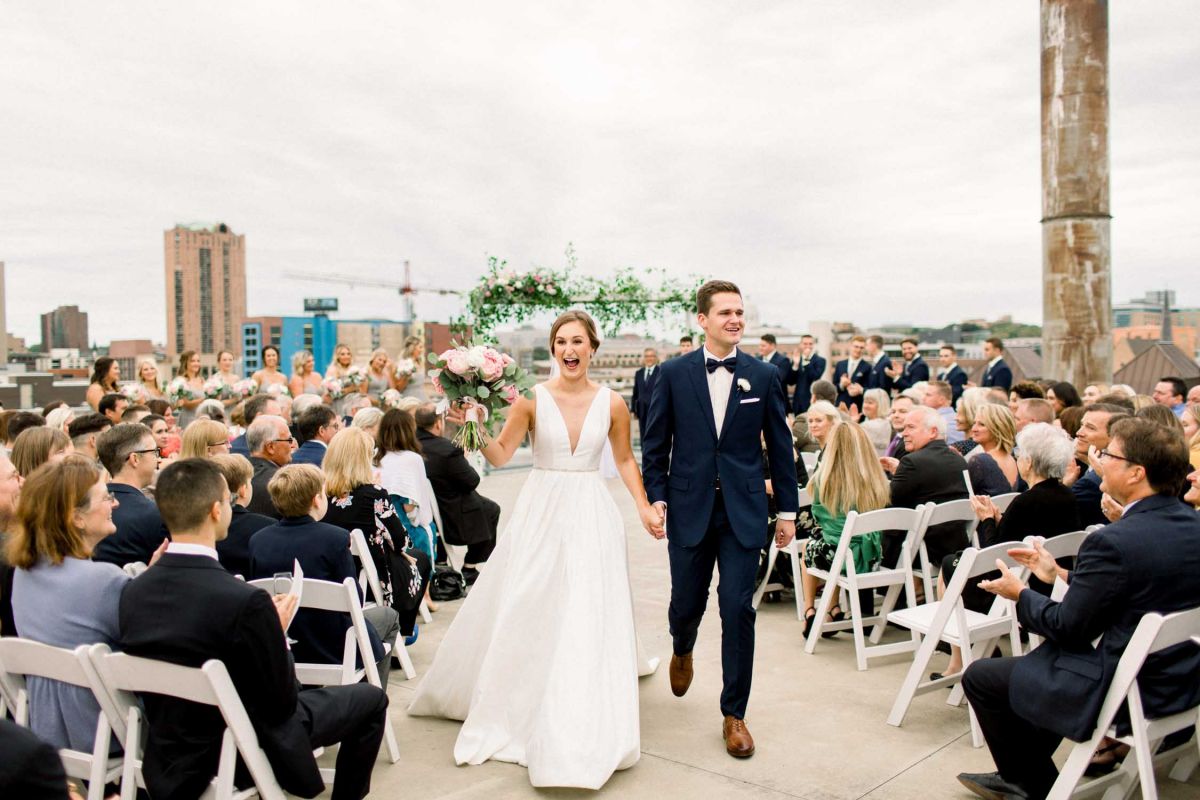 bride and groom walking down aisle 