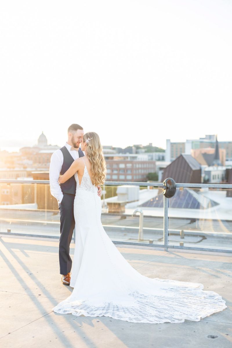 couple posing on rooftop