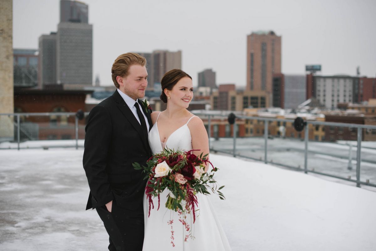couple posing on rooftop