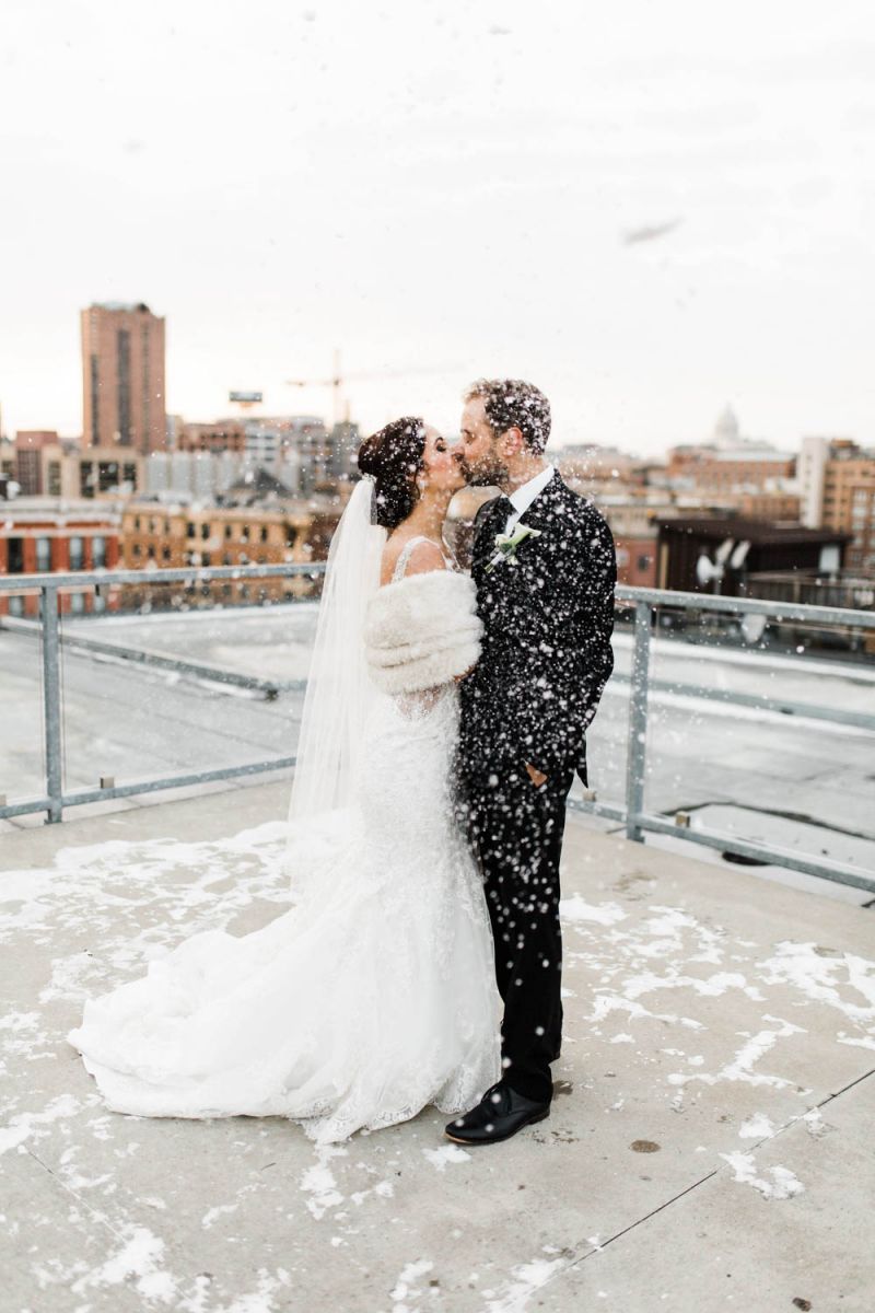 couple posing on rooftop