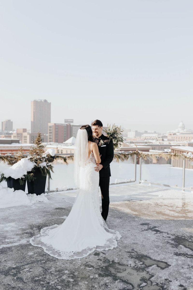 couple posing on rooftop