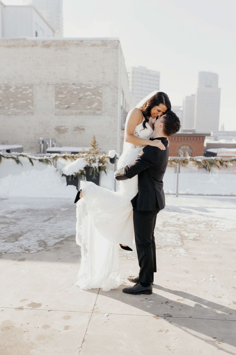 couple embracing on rooftop
