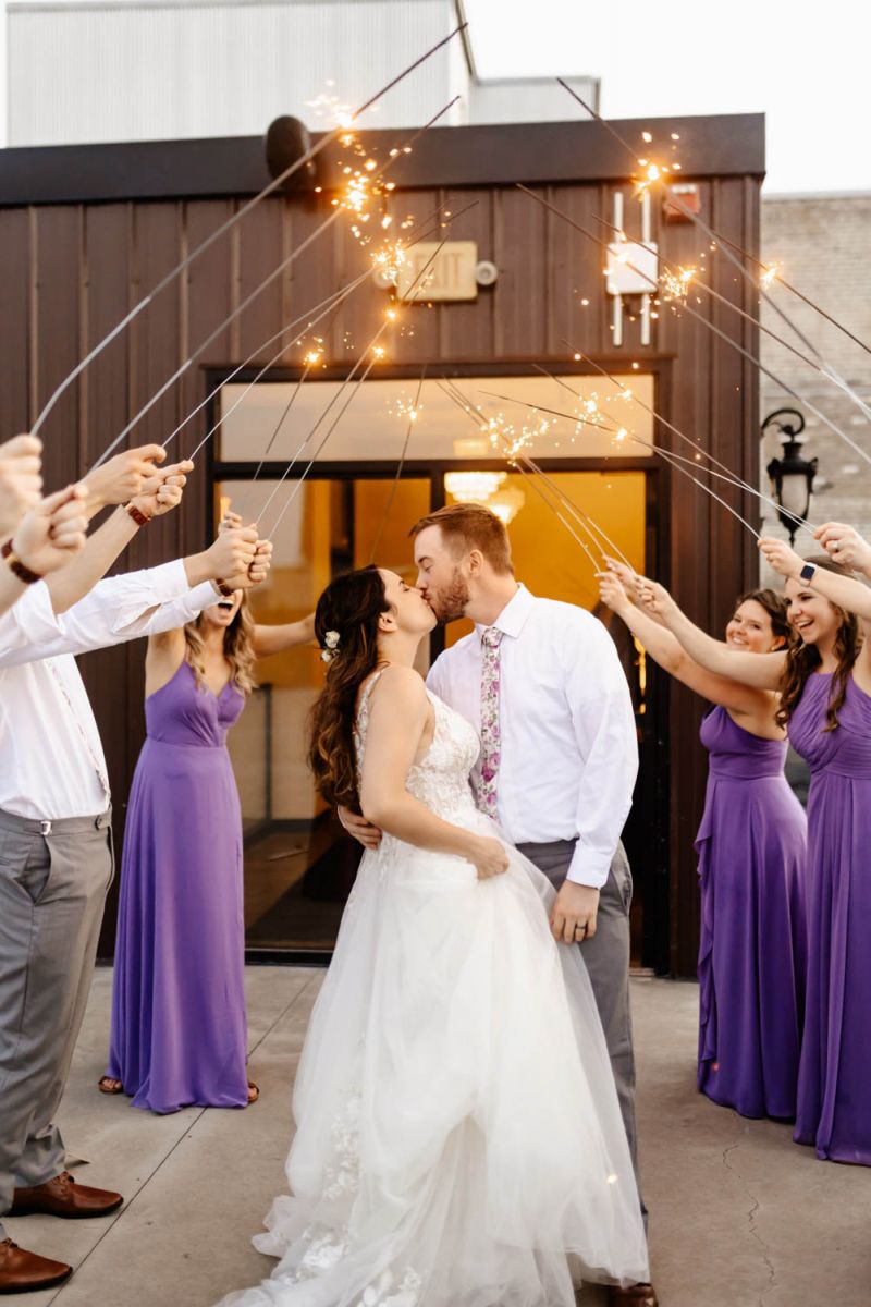 couple kissing under sparklers