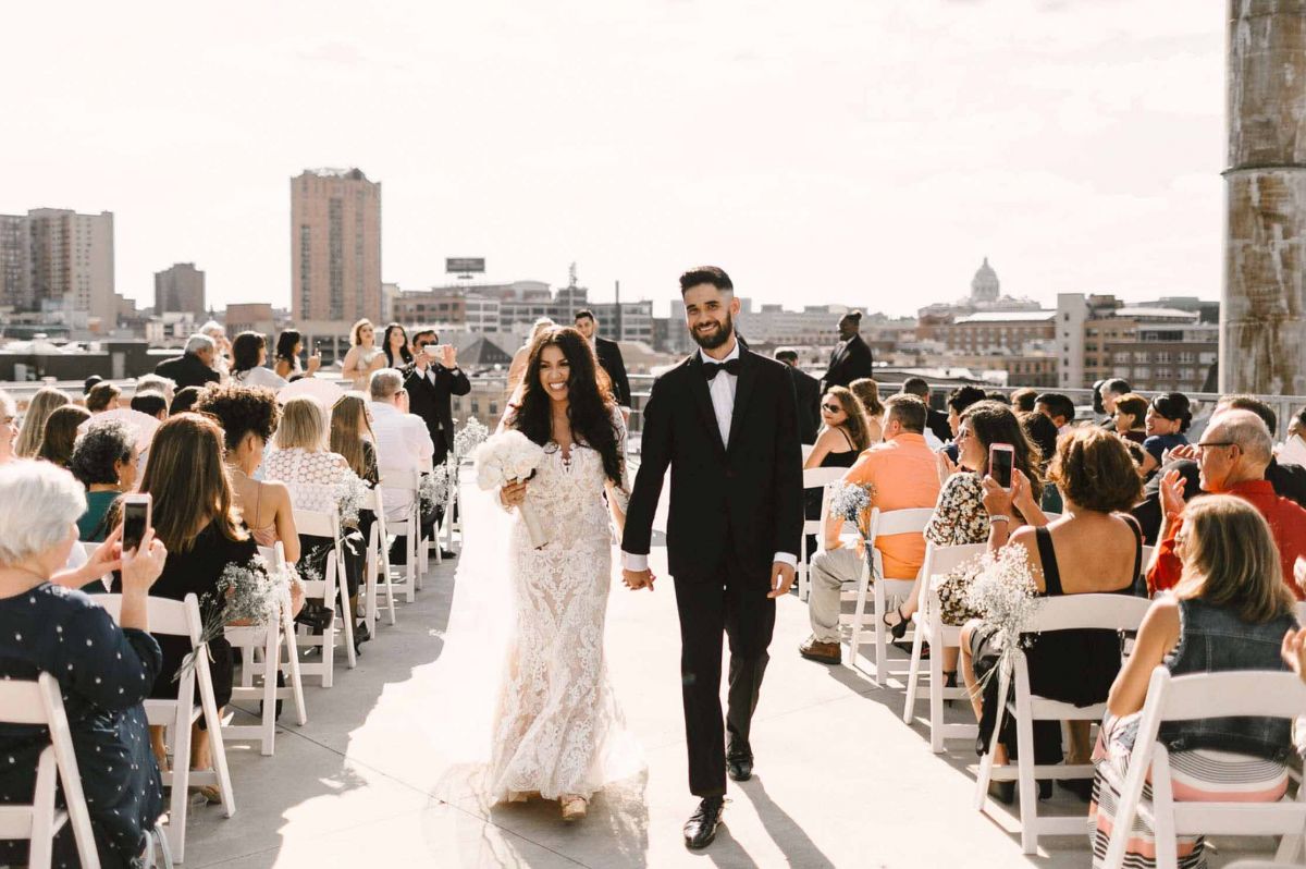 couple walking down aisle