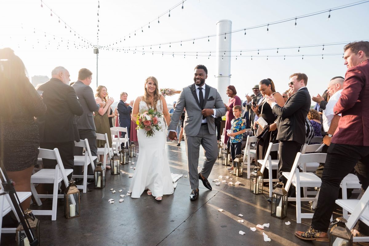 couple walking down aisle 