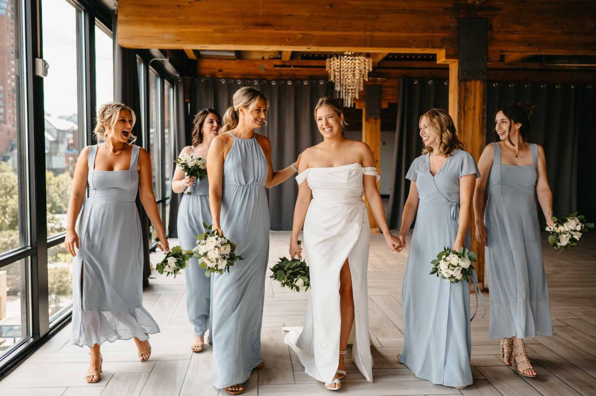 Bride and bridesmaids posing at A'BULAE