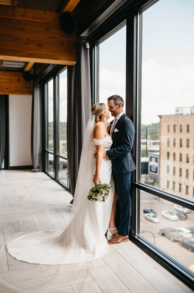 Couple in front of windows at A'BULAE