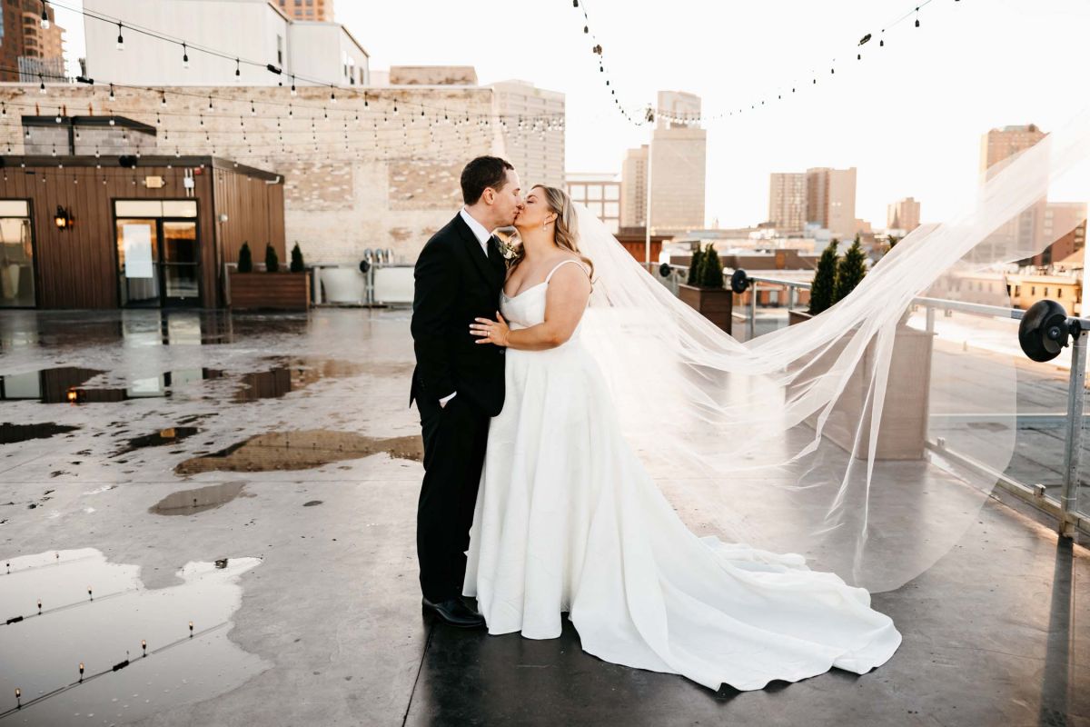 Bride and groom on rooftop at A'BULAE
