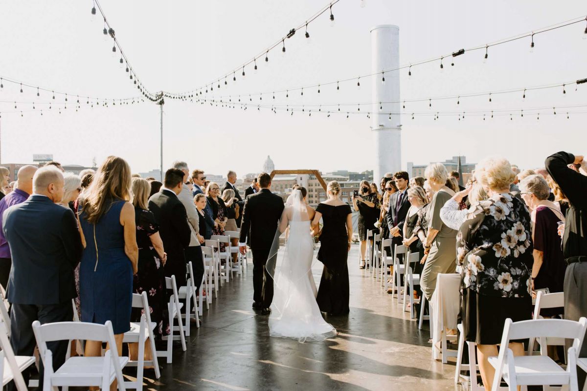 couple walking down aisle