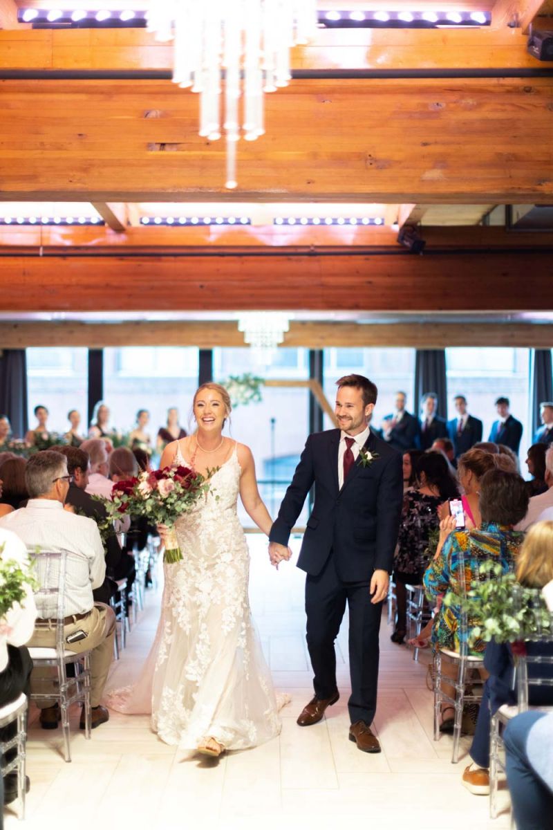 couple walking down aisle