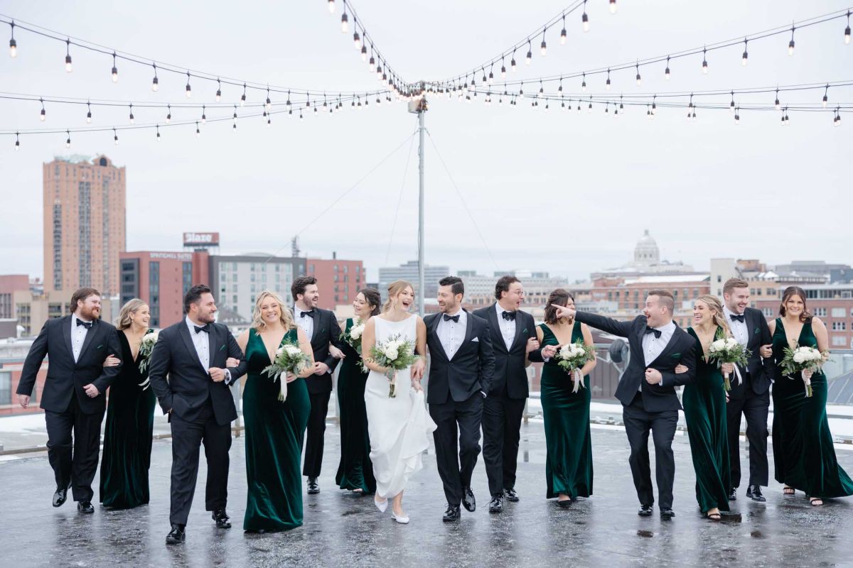 Wedding party posing on rooftop at A'BULAE