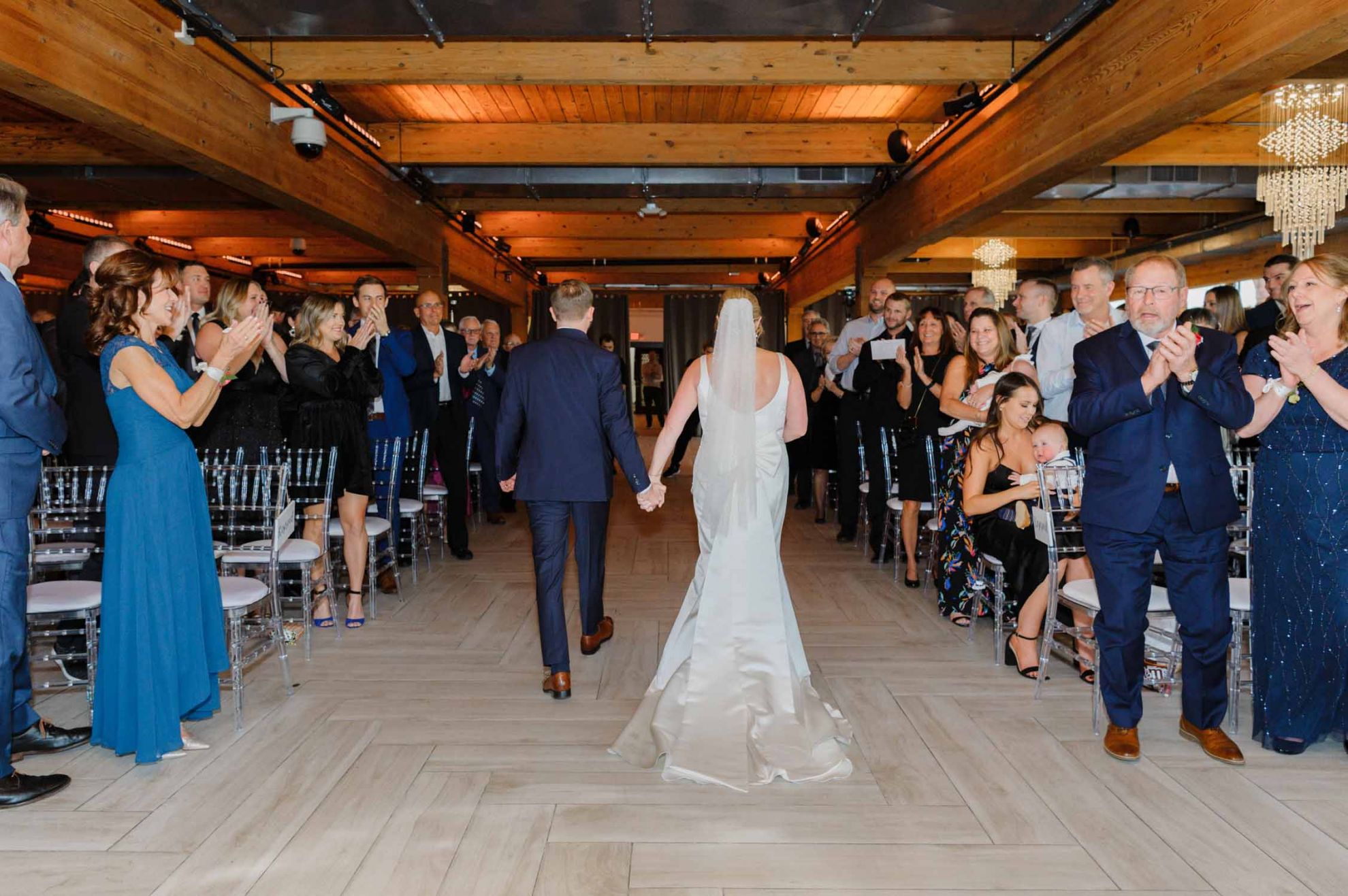 couple walking down aisle