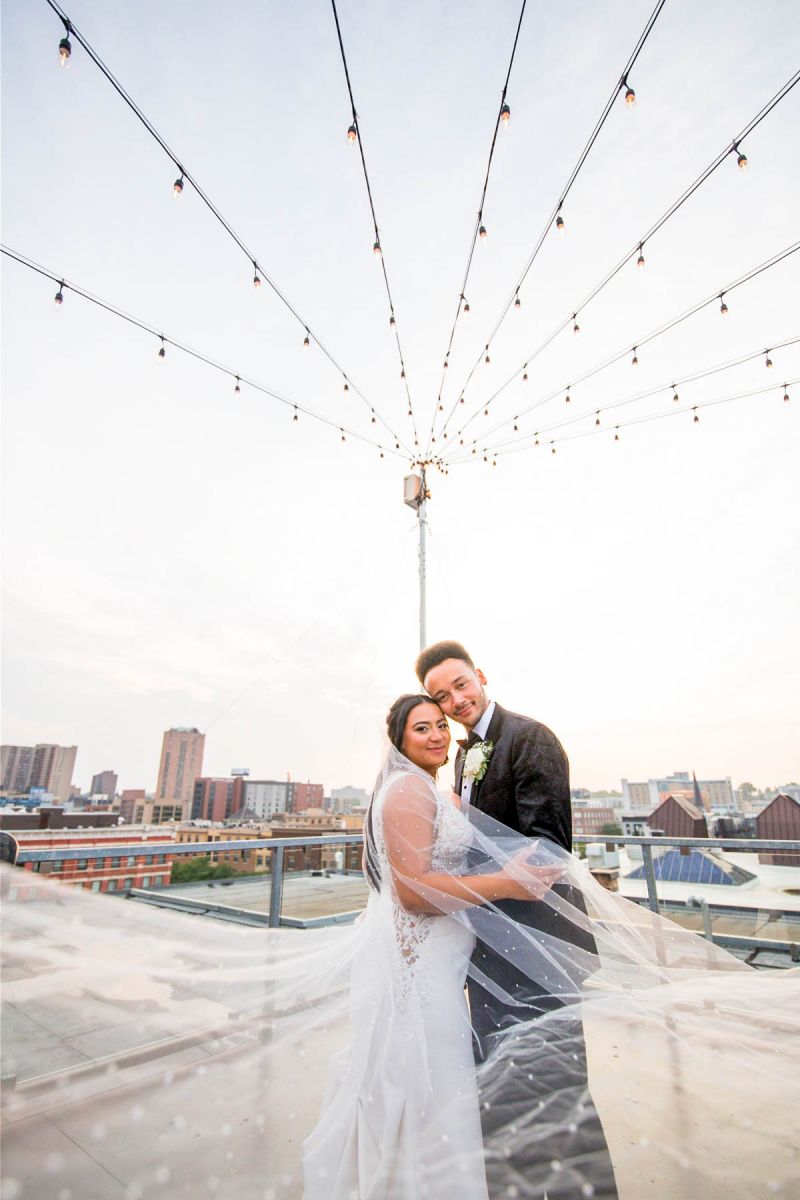 Couple posing on rooftop at A'BULAE