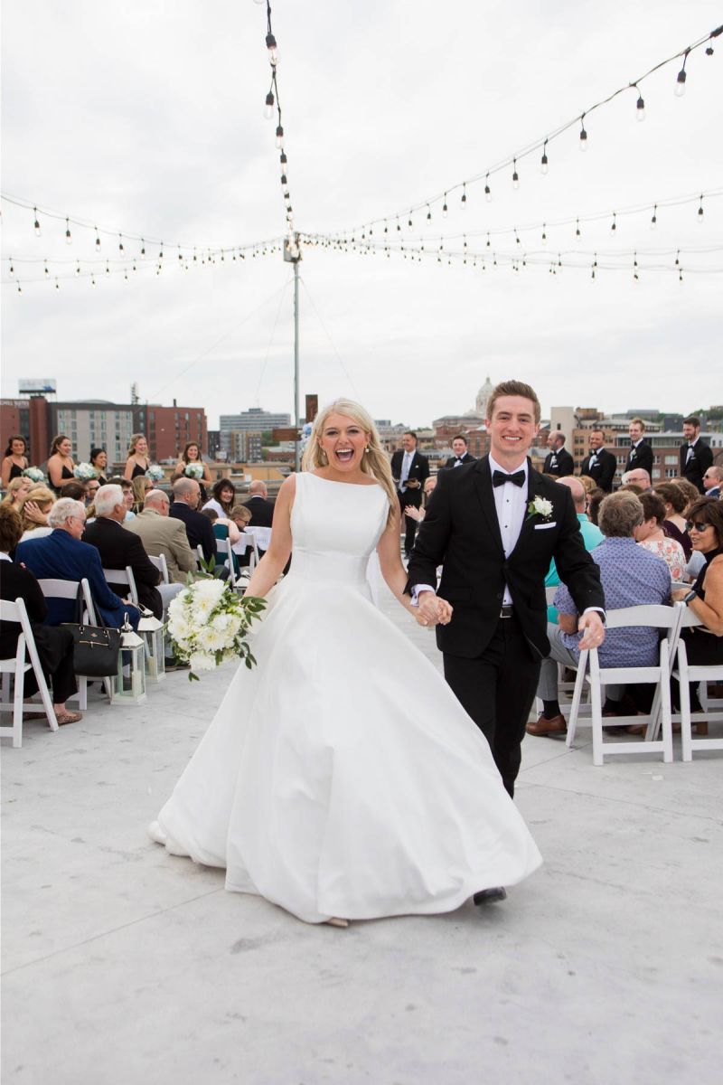 couple walking down aisle