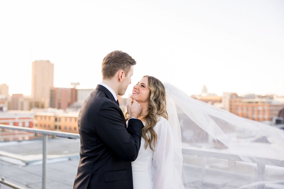 couple posing on rooftop