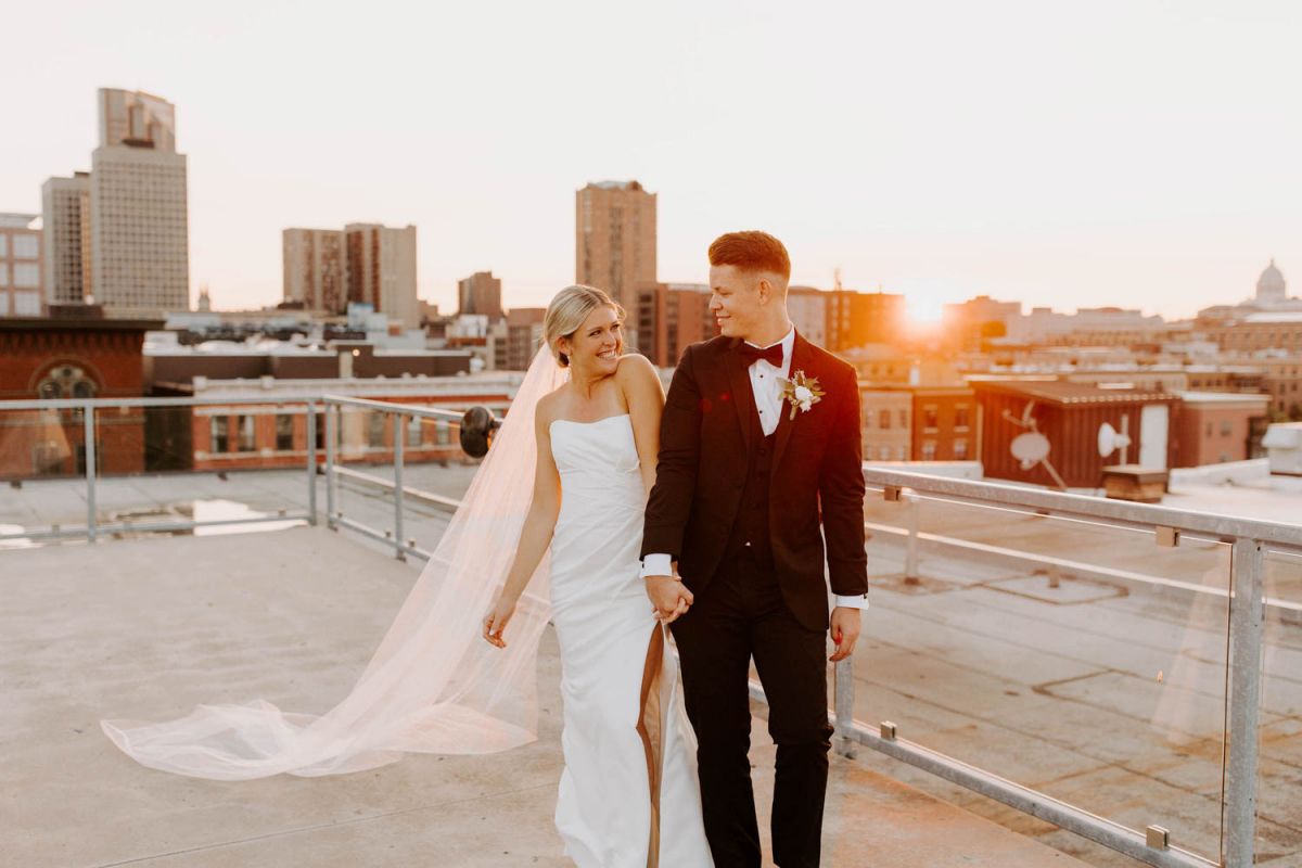 couple on rooftop at sunset