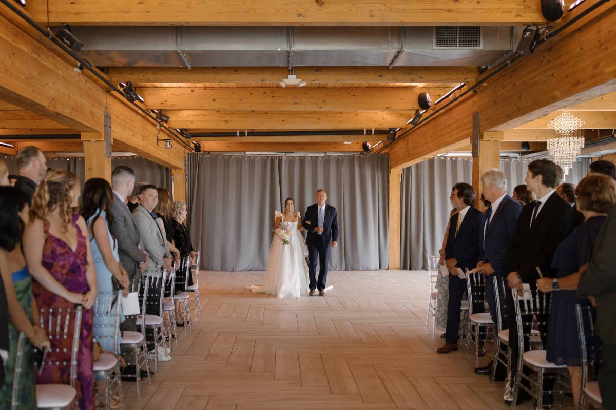 couple walking down aisle