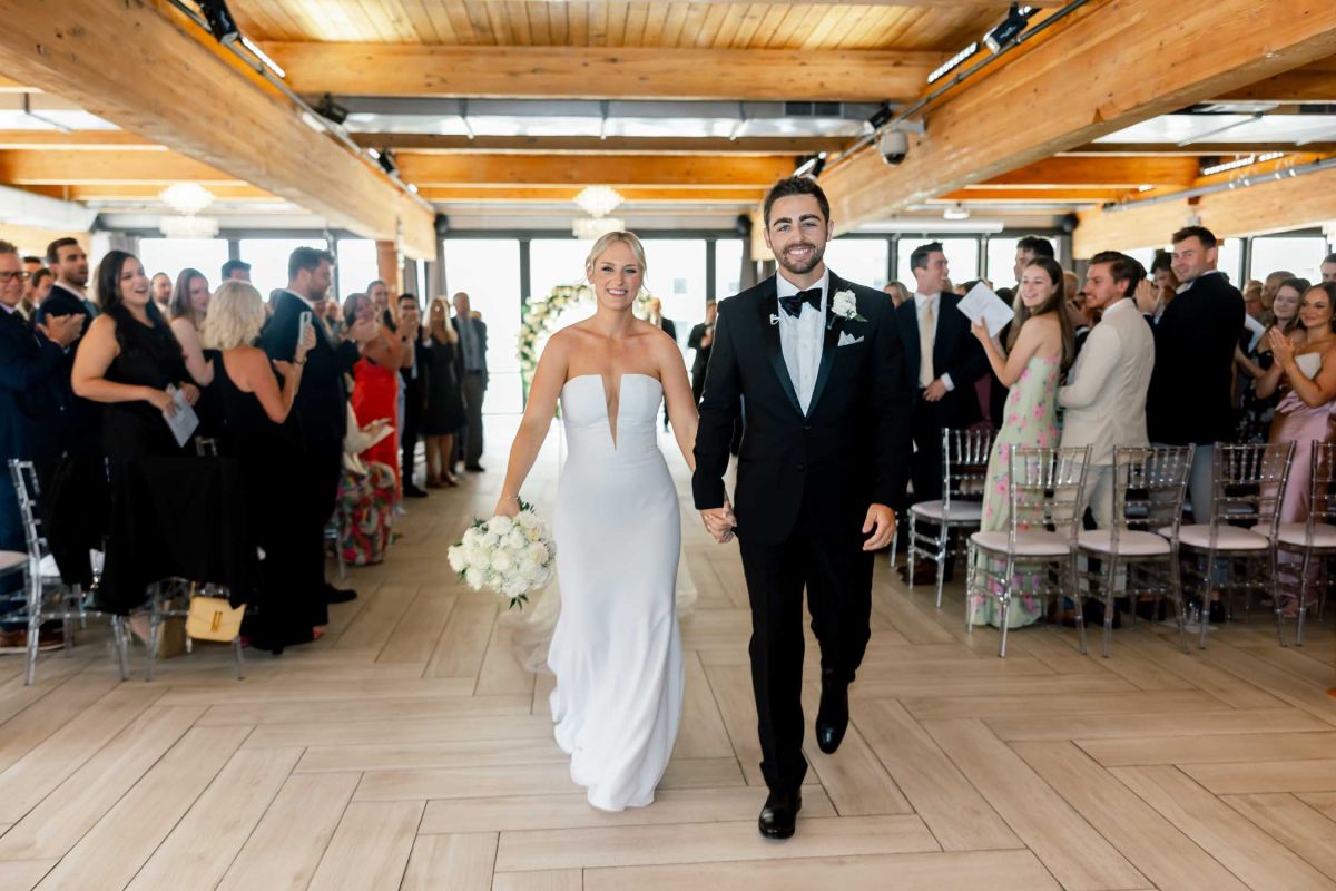 couple walking down aisle