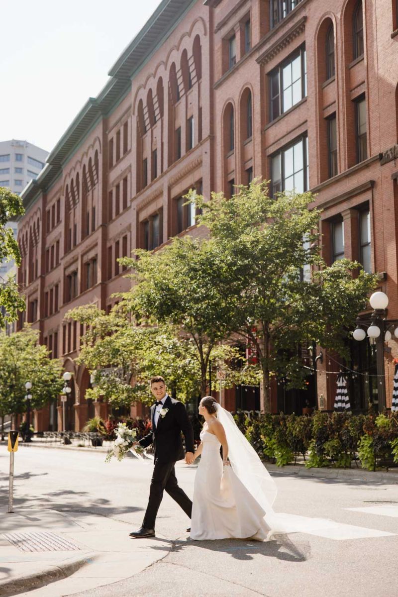 bride and groom walking to the park