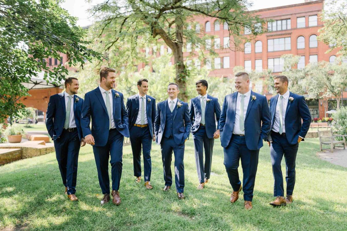 groomsmen walking in the park