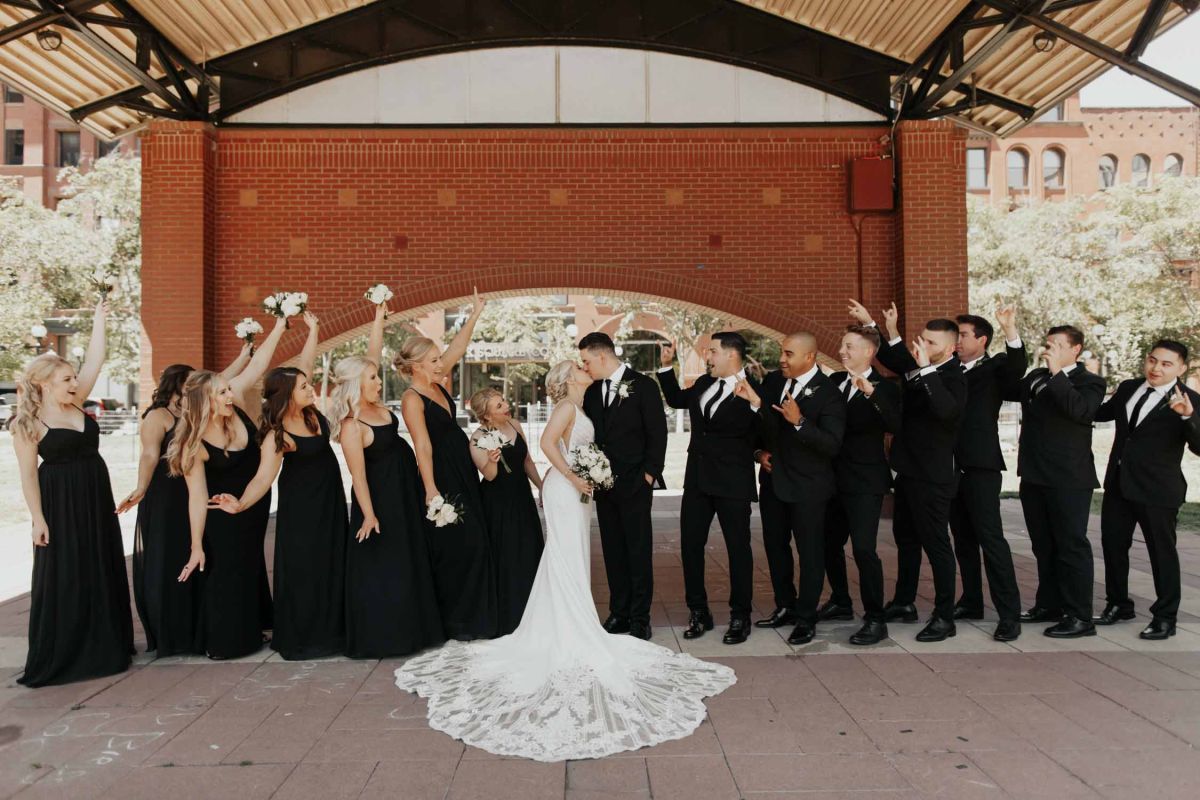 bride and groom with wedding party